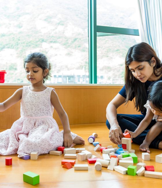 Indian family play toy block together at home