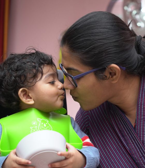 A mother bumping her nose to her baby's nose